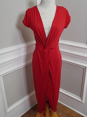 Rolla Coster red maxi dress featuring a V-neckline and a front twist detail.